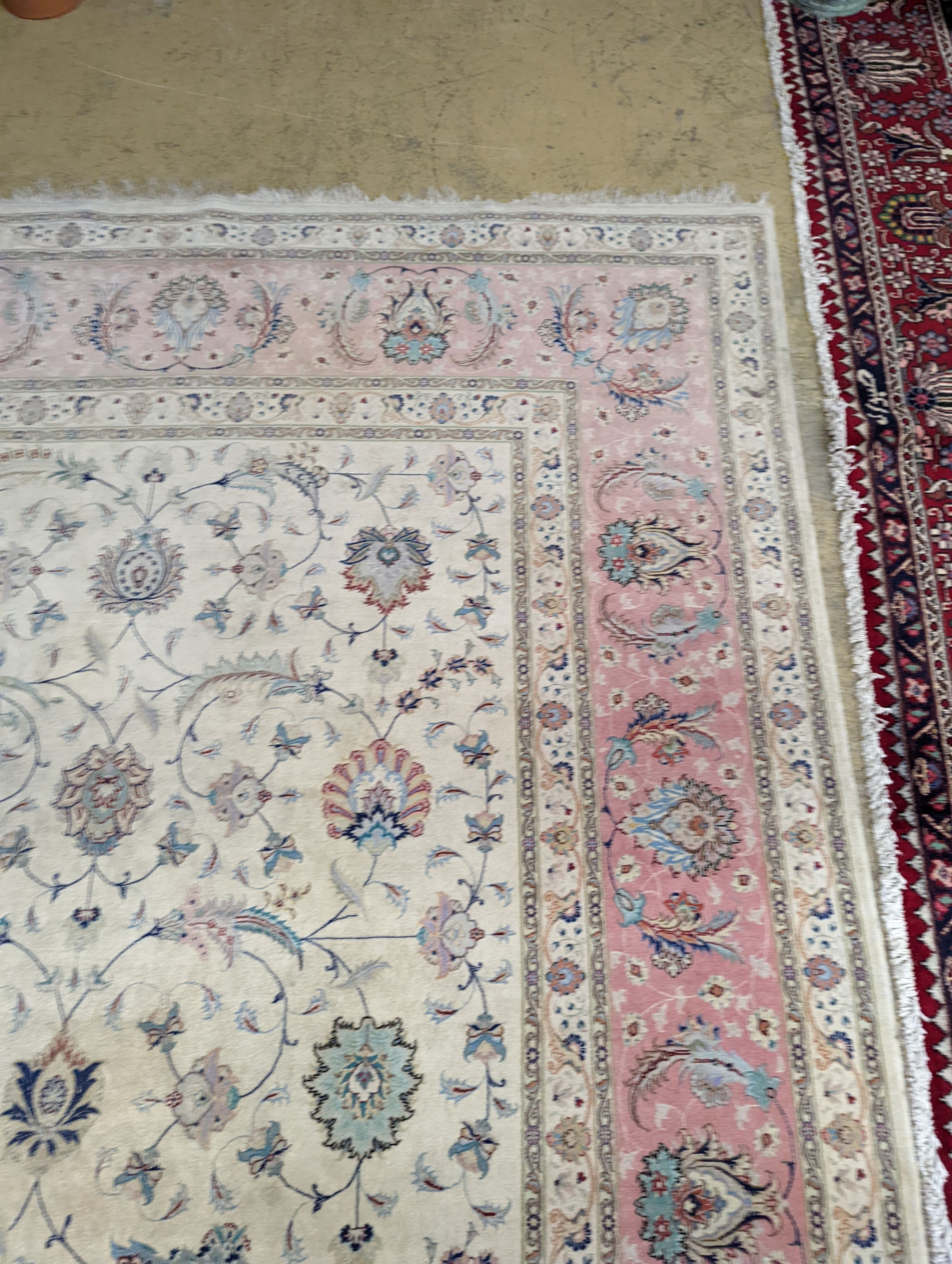 A Persian Tabriz ivory ground carpet, 410 x 300cm